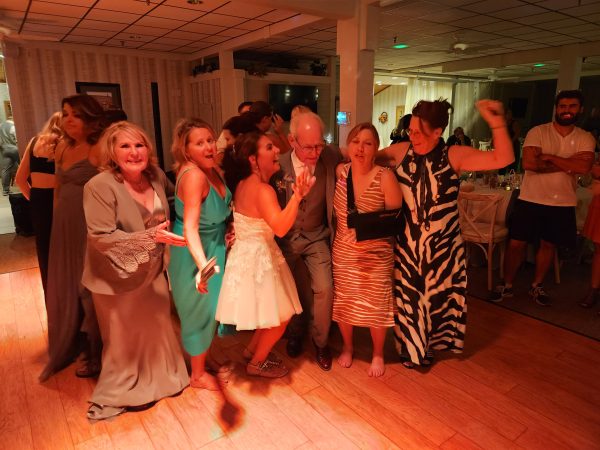 The Unsung Hero of Your Wedding: The Essential Role of a Professional DJ